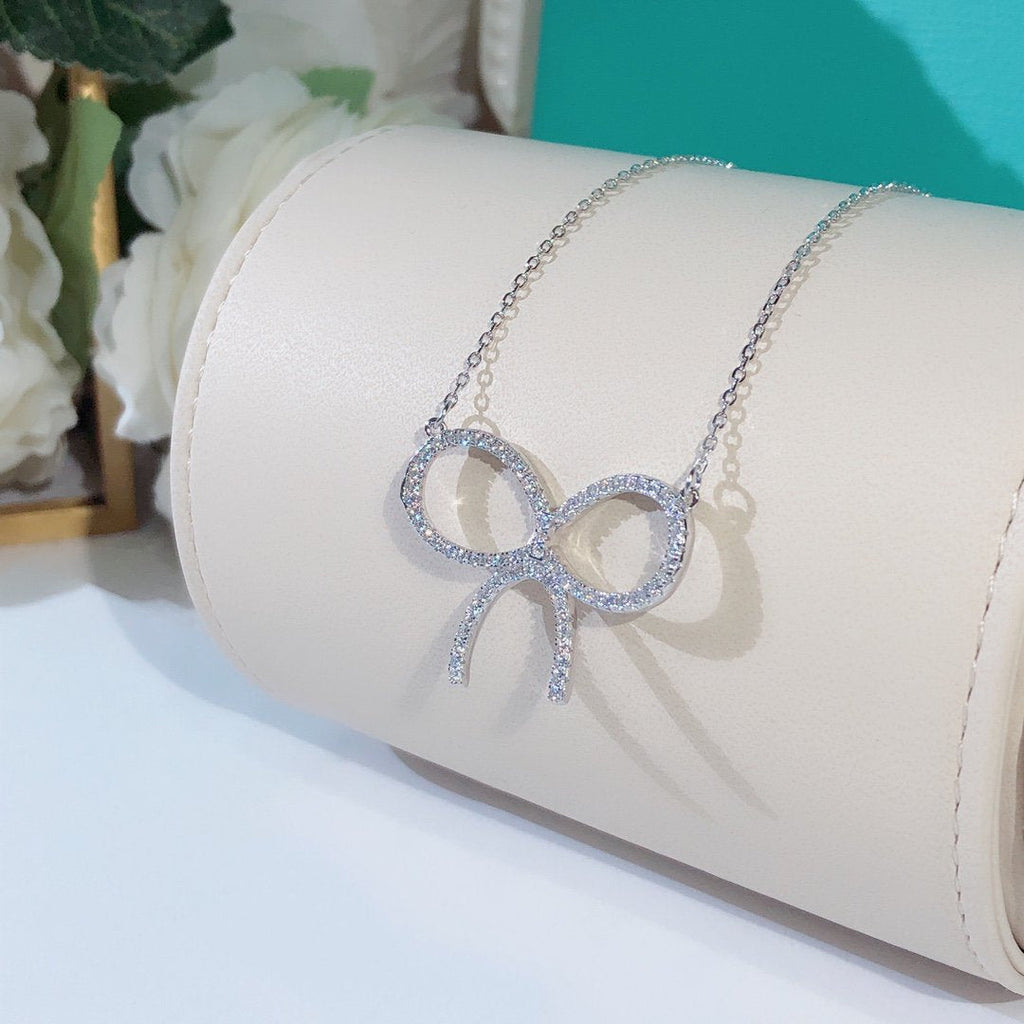 TIFFANY CLAW SET RHODIUM PLATED BOW NECKLACE
