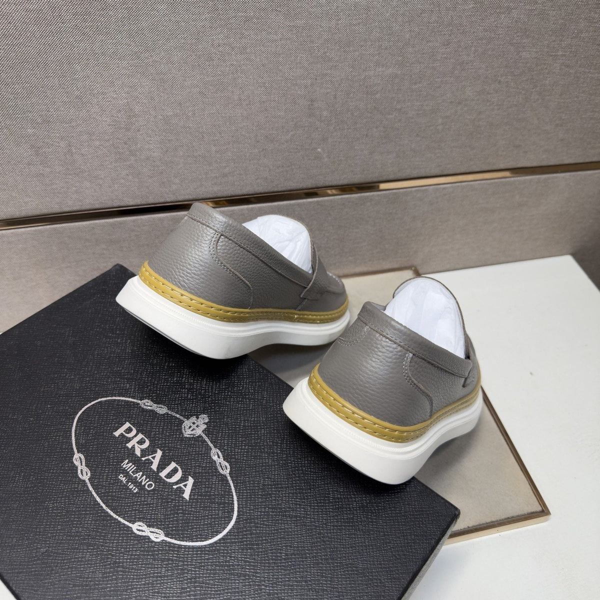 Prada Gold Accent Slip-On Loafers